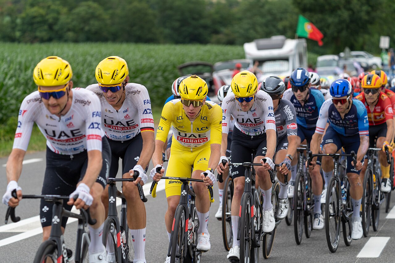 Tadej Pogacar and his UAE Team Emirates leading the peloton during a mountain climb at Tour de France 2024